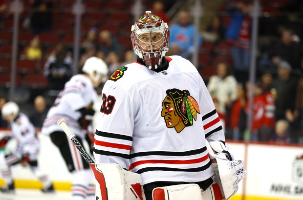 Blackhawks goaltender Drew Commesso skates during warmups before a game against the Devils on Dec.14, 2024, in Newark, N.J. (Noah K. Murray/AP)