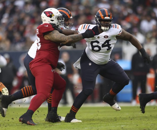 Bears guard Nate Davis (64) disengages from Cardinals defensive end Jonathan Ledbetter on Dec. 24, 2023, at Soldier Field. (Talia Sprague/Chicago Tribune)