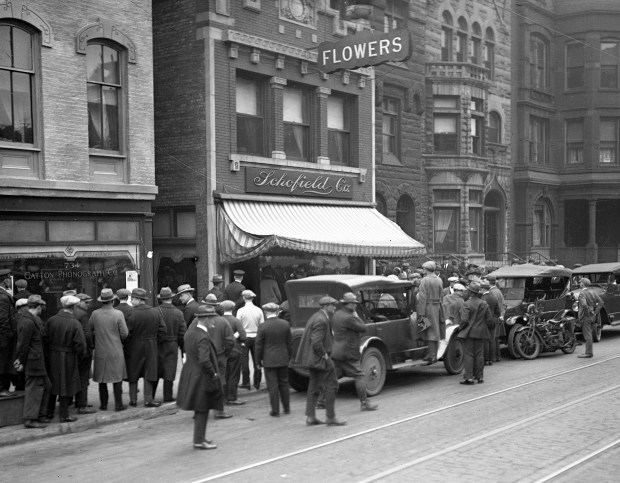 A crowd gathers outside gangster Dean O'Banion's flower shop, Schofield Co. at 738 N. State Street, after he was shot and killed on Nov. 10, 1924. Three assassins enter the flower shop, talked with O'Banion and then opened fire at only a few feet distance. (Chicago Tribune historical photo)