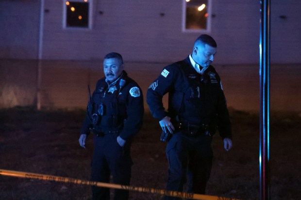 Chicago police remain at the scene of a shooting at 14th Street and Avers Avenue in which a toddler reportedly was shot multiple times on Dec. 26, 2024. (Terrence Antonio James/Chicago Tribune)