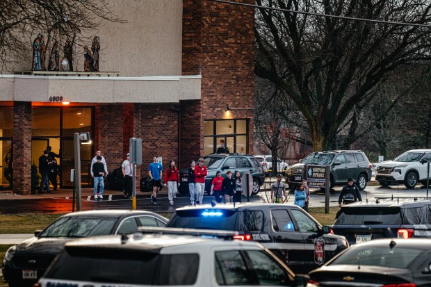 Children leave the City Church Sanctuary to board buses to reunite with their families after a shooting at the Abundant Life Christian School in Madison, Wisconsin, on Dec. 16, 2024. (Jamie Kelter Davis/The New York Times)