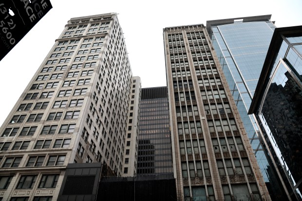 The Consumers Building, left, 220 S. State Street, and the Century Building, 202 S. State Street, April 17, 2023. (Antonio Perez/ Chicago Tribune)