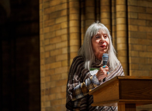 Emma Lozano speaks with attendees during a community meeting to discuss a construction permit Sims was granted by the Illinois Environmental Protection Agency at St. Paul Catholic Church on Sept. 29, 2022. (Armando L. Sanchez/Chicago Tribune)