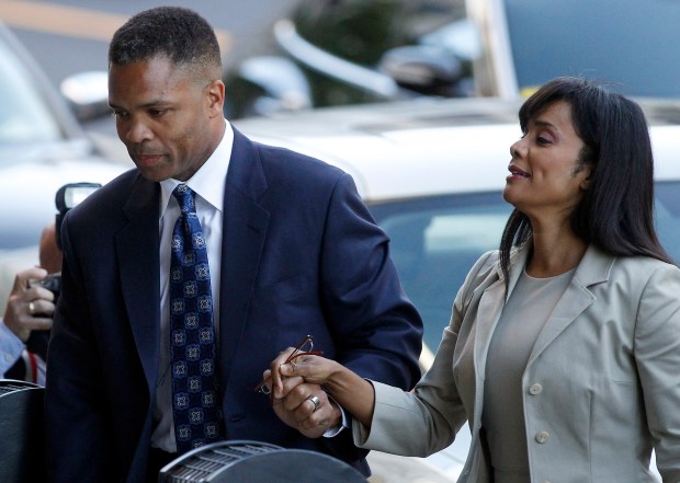 Former U.S. Rep. Jesse Jackson Jr. and then his wife, former Ald. Sandi Jackson, arrive at their sentencing hearing on on Aug. 14, 2013 at E. Barrett Prettyman Federal Courthouse in Washington. (Brian Cassella/Chicago Tribune)