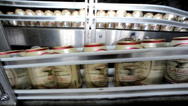 Cans of lager travel on a conveyor at Yuengling brewery in Pottsville, Pennsylvania. (Donna Fisher/The Morning Call)