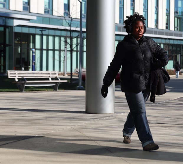 Kayla Daley, 21, walks through the UIC campus on Dec. 5, 2024. (Stacey Wescott/Chicago Tribune)