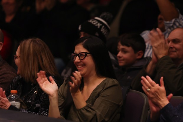 Audience members applaud choir students during the 61st annual Winter Arts Showcase, a production by the Chicago Public Schools All-City Performing Arts (ACPA) program, at Jones College Prep on Dec. 14, 2024. (John J. Kim/Chicago Tribune)