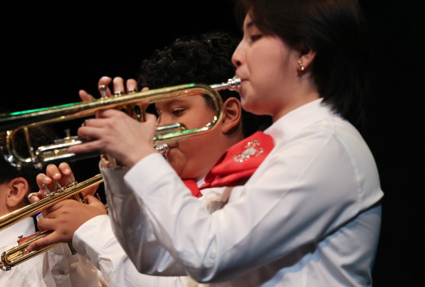 Mariachi student trumpeters Fonzi Moreno, 12, left, and Madeline Lopez, 17, perform during the 61st annual Winter Arts Showcase. (John J. Kim/Chicago Tribune)