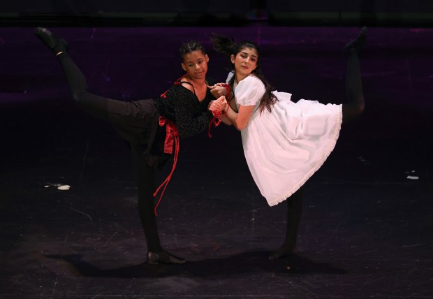 Dance students Maya Horton, 13, left, and Adela Salcedo, 15, perform a duet during the 61st annual Winter Arts Showcase, a production by the Chicago Public Schools All-City Performing Arts (ACPA) program, at Jones College Prep On Dec. 14, 2024. (John J. Kim/Chicago Tribune)