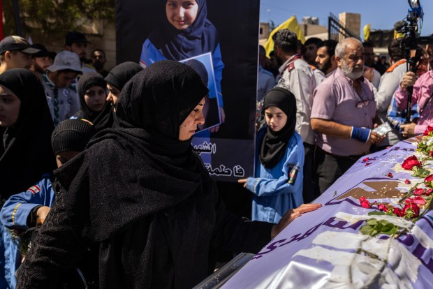 Mourners at the funeral for Fatima Abdullah, the 9-year-old girl among those killed in the pager attack, in the village of Saraain El Faouqa, Lebanon on Sept. 18, 2024. Israel and Lebanon on Wednesday were tensely awaiting a potential response by Hezbollah and its allies after at least 12 people were killed and thousands more injured in Lebanon in an apparently coordinated attack that targeted members of the group by blowing up their pagers. (Diego Ibarra Sanchez/The New York Times)