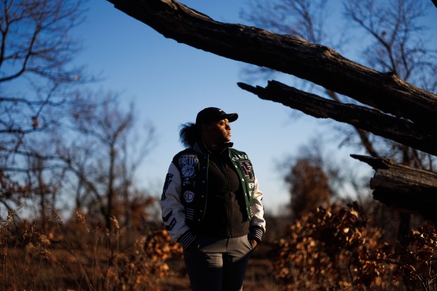 Mihesha Gibbs-Lumpkins, 36, community engagement coordinator for the Nature Conservancy and a Hopkins Park village trustee, stands in the Pembrook Savanah in Hopkins Park on Dec. 1, 2024. (Armando L. Sanchez/Chicago Tribune)