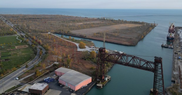 An empty parcel of land, top, is all that remains of the former U.S. Steel South Works site on Oct. 22, 2024, in Chicago. PsiQuantum has plans to anchor the new Illinois Quantum & Microelectronics Park, a 128-acre quantum campus, on the site. (Stacey Wescott/Chicago Tribune)