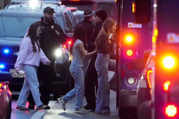 Students aboard a bus as they leave the shelter following a shooting at the Abundant Life Christian School on Dec. 16, 2024, in Madison, Wisconsin. (Morry Gash/AP)