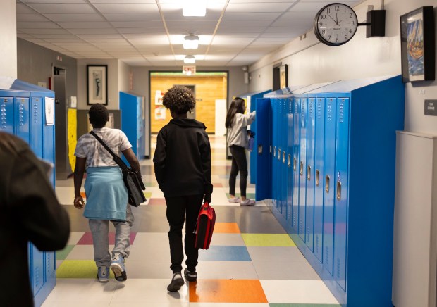 Students walk the hallways on Nov. 8, 2023, at Bronzeville Classical School. The Chicago Teachers Union has proposed contract language to CPS that Service Employees International Union 73, the union that represents special education classroom assistants in Chicago Public Schools, fears would allow classroom assistants, who are represented by CTU, to take over some of the special education classroom aides' jobs. (Brian Cassella/Chicago Tribune)