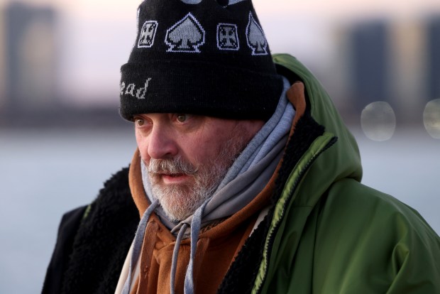 Daniel O'Conor prepares for his daily jump into Lake Michigan near Montrose Harbor on Dec. 12, 2024. (Antonio Perez/Chicago Tribune)