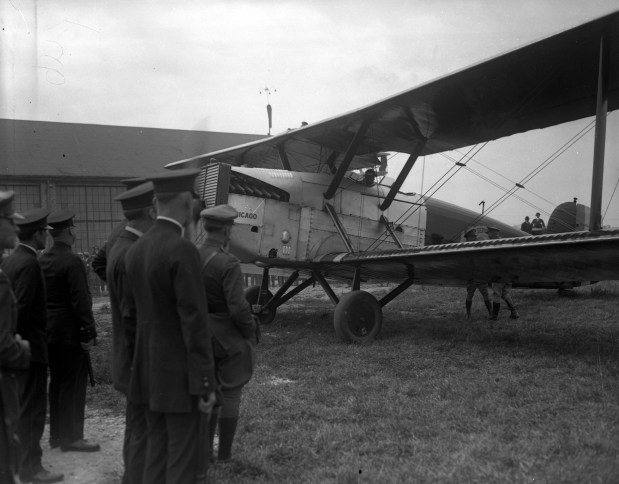 The plane Chicago lands at a small airstrip just outside of west suburban Maywood on Sept. 15, 1924, during the first aerial circumnavigation of the globe by the U.S. Army World Fliers. The Chicago was flown by Lts. Lowell Smith and Leslie Arnold. (Chicago Herald and Examiner) 