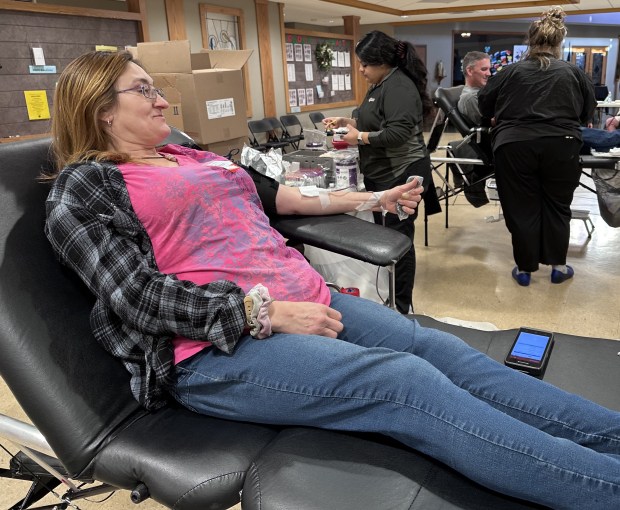 Rita LeBeau of Beach Park donates a pint of blood during a blood drive in Gurnee. (Yadira Sanchez Olson/For the Lake County News-Sun)