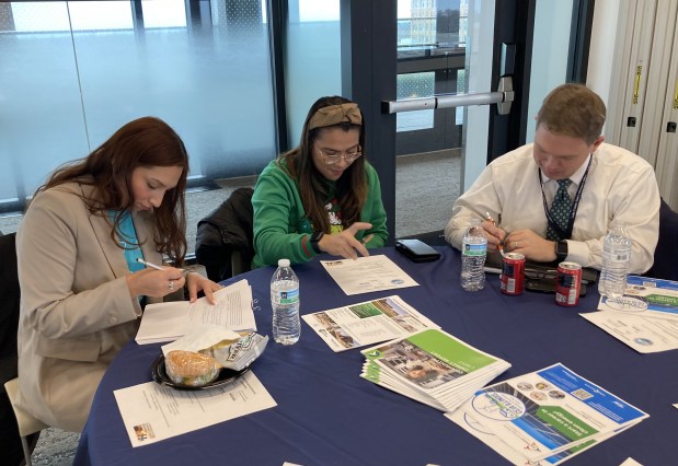 Preparing for their presentations to the Waukegan Intergovernmental Committee are, from left, Joanna Jaimes, Dulce Ortiz and Eric Rinehart. (Steve Sadin/For the Lake County News-Sun)