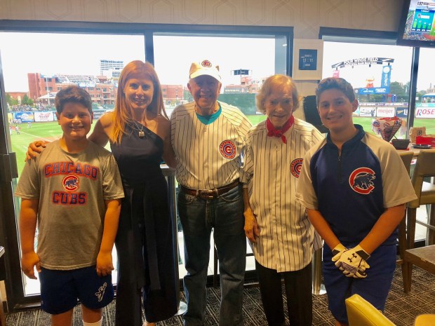 Cole Berlin, from left, Courtney Berlin, President Jimmy Carter, First Lady Rosalynn Carter and Gavin Berlin posed at a South Bend Cubs baseball game. Andrew Berlin of Glencoe, who was out of town the night of the game, owns the team and invited the Carters, who were volunteering in Indiana with Habitat for Humanity. (Andrew Berlin)