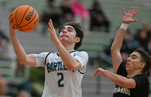 Bartlett's Joey Cwik (2) puts up a shot in front of Streamwood's Payton Clements (20) during the 2nd quarter of Friday evening's game, Jan. 3, 2025. Bartlett won the game, 68-42. (Brian O'Mahoney for the The Courier-News)