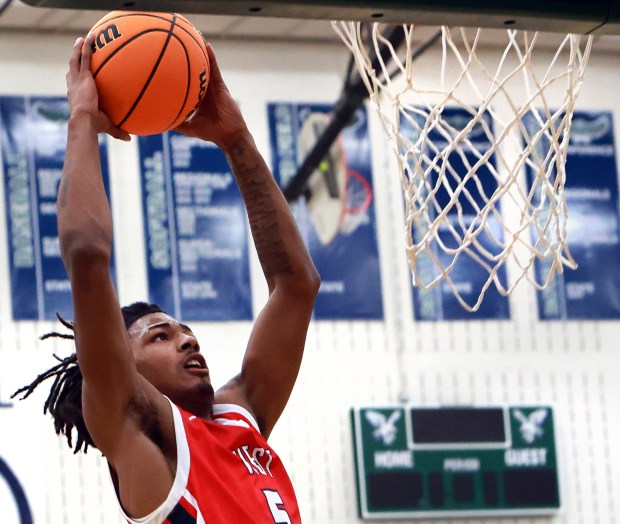 West Aurora's Terrence Smith slams the ball during the basketball game against Bartlett in Bartlett on Friday, Jan. 10, 2025. (James C. Svehla / for the Beacon-News)