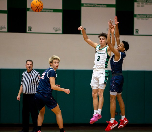 Ridgewood's Luke Melendez (3), right, passes the ball during a game against West Aurora in Norridge on Thursday, Jan. 23, 2025. (Nate Swanson / for the Beacon-News)