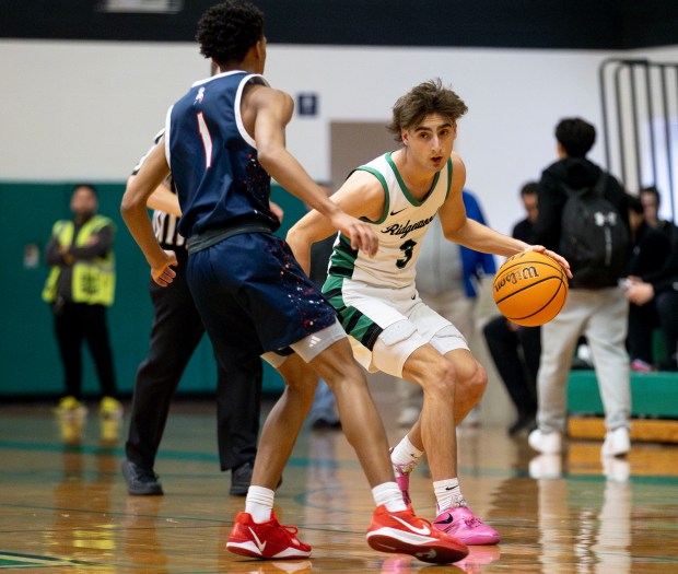 Ridgewood's Luke Melendez (3) dribbles around West Aurora's Travis Brown (1) during a game in Norridge on Thursday, Jan. 23, 2025. (Nate Swanson / for the Beacon-News)