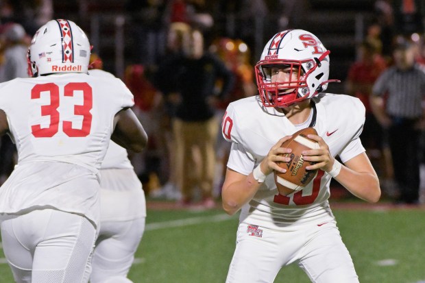 South Elgin quarterback Carter McDonald (10) looks for an open receiver against Batavia on Friday, Sept. 6, 2024. (Mark Black / The Beacon-News)