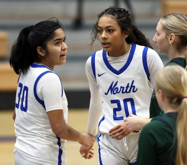 St. Charles North's Lelanie Posada (30) and Sydney Johnson (20) celebrate a basket in the third quarter against Bartlett during a non conference game in St. Charles on Wednesday, Jan. 15, 2025.H. Rick Bamman / For the Beacon News