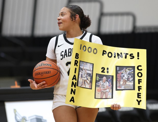 Streamwood's Brianna Coffey (21)reacts to cheers from the crowd after scoring her 1000th career point during a non conference game against Jacobs in Streamwood on Monday, Jan. 27, 2025.(H. Rick Bamman/for the Beacon-News)