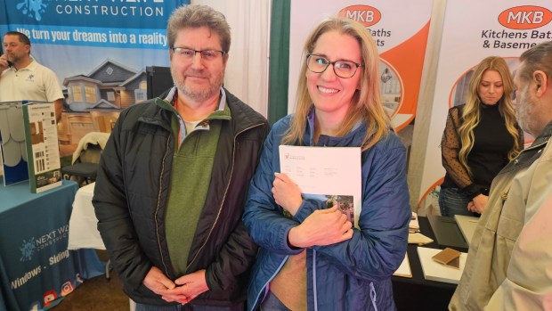 Mike and Liz Gunner of South Elgin, who are looking to do a landscaping project at their house, came to the Kane County Home Show at the fairgrounds in St. Charles on Saturday. (David Sharos / For The Beacon-News)