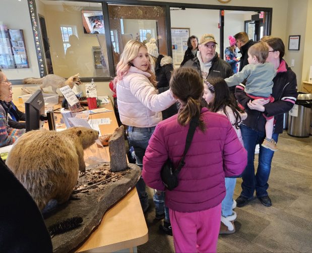 Participants stream through the entrance at the Creek Bend Nature Center in St. Charles on Saturday for the Kane County Forest Preserve District's first-ever Polar Palooza festival. (David Sharos / For The Beacon-News)