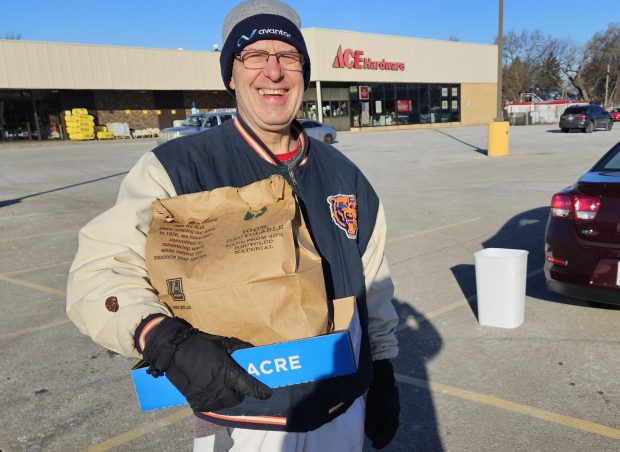 Don White of Montgomery brings bags of magazines and other paper items to be recycled Saturday at a pop-up recycling event held in the parking lot of the Ace Hardware store at 994 N. Lake St. (David Sharos / For The Beacon-News)