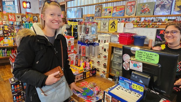 Alice Froemling of South Elgin, left, says it's fun to bring the kids in and let them pick out a few types of candy at the Rocket Fizz store at 301 W. Main St. in St. Charles. (David Sharos / For The Beacon-News)