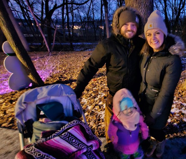 Alicia and Ryan Frantzen of Aurora brought their daughter and son for the first time to Frosty Fest, held Saturday night at the Red Oak Nature Center in North Aurora. (David Sharos / For The Beacon-News)