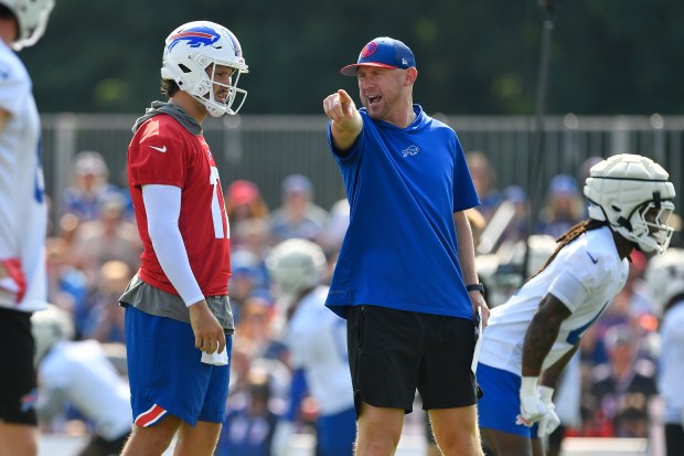 Bills offensive coordinator Joe Brady talks with quarterback Josh Allen during training camp in Pittsford, N.Y., on July 24, 2024. (AP Photo/Adrian Kraus)