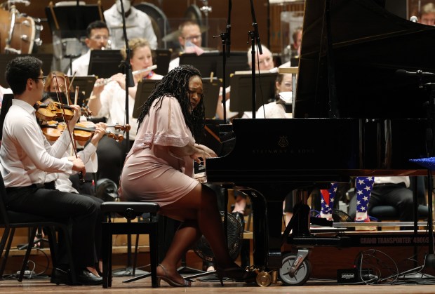 Pianist Michelle Cann performs with the Grant Park Orchestra at Jay Pritzker Pavilion in Chicago for an Independence Day concert in July 2023. (John J. Kim/Chicago Tribune)