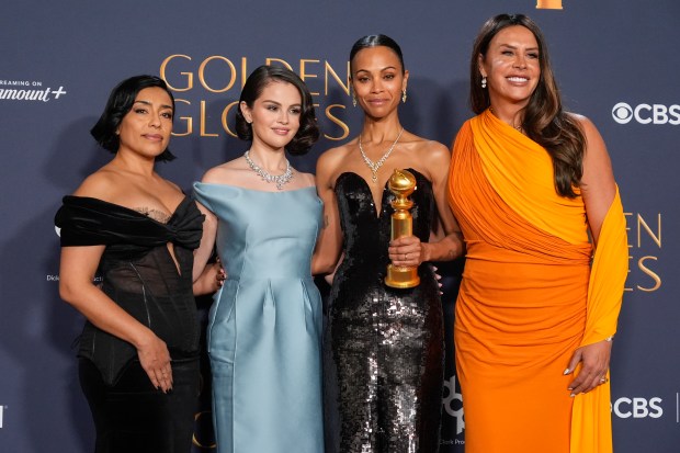 Adriana Paz, from left, Selena Gomez, Zoe Saldana, winner of the award for best performance by a female actor in a supporting role in any motion picture for "Emilia Perez," and Karla Sofia Gascon pose in the press room during the 82nd Golden Globes on Sunday, Jan. 5, 2025, at the Beverly Hilton in Beverly Hills, Calif. (AP Photo/Chris Pizzello)