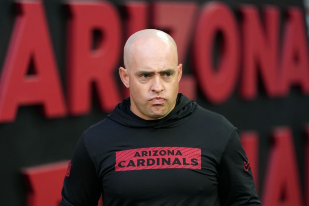 Cardinals offensive coordinator Drew Petzing walks on the field prior to a game against the 49ers on Jan. 5, 2025, in Glendale, Ariz. (AP Photo/Ross D. Franklin)