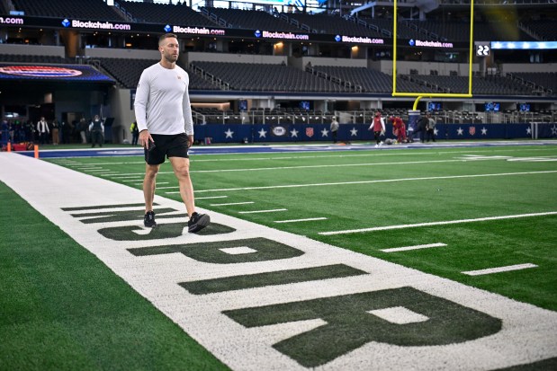 Commanders offensive coordinator Kliff Kingsbury walks on the field before a game against the Cowboys on Jan. 5, 2025, in Arlington, Texas. (AP Photo/Jerome Miron)