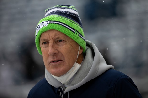 Seahawks coach Pete Carroll takes the field before a game against the Bears on Dec. 26, 2021, in Seattle. (Erin Hooley/Chicago Tribune)