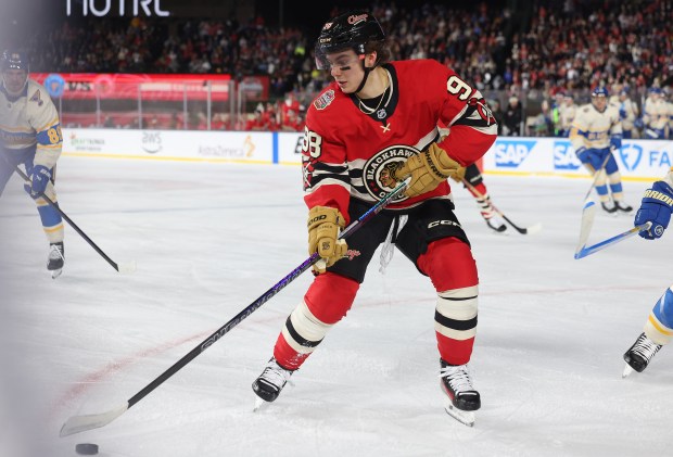 Blackhawks center Connor Bedard (98) handles the puck in the first period against the Blues in the NHL Winter Classic at Wrigley Field on Dec. 31, 2024. (John J. Kim/Chicago Tribune)