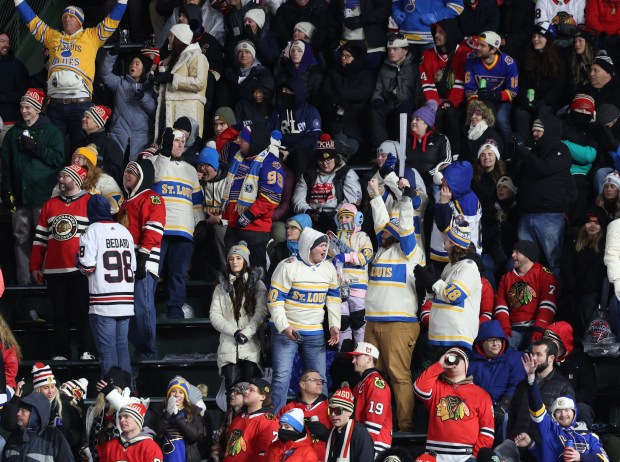 Blues fans celebrate as the team scores its sixth goal of the game against the Blackhawks, in the third period of the NHL Winter Classic at Wrigley Field on Dec. 31, 2024. (John J. Kim/Chicago Tribune)