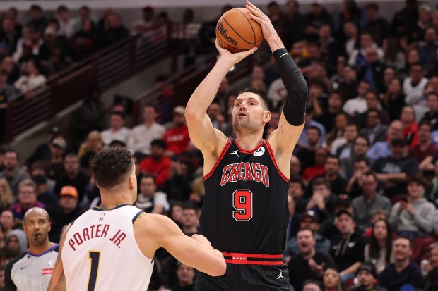 Bulls' Nikola Vučević shoots over the Nuggets' Michael Porter Jr. during the second half at the United Center on Jan. 27, 2025. (Photo by Michael Reaves/Getty Images)