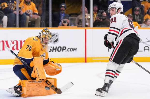 Predators goaltender Juuse Saros blocks a shot on goal by the Blackhawks' Frank Nazar during the first period on Jan. 16, 2025, in Nashville, Tenn. (AP Photo/George Walker IV)