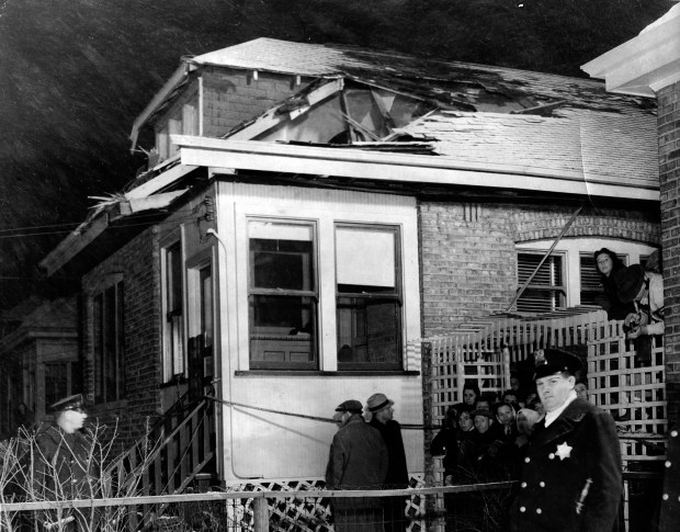 On Dec. 4, 1940 a United Airlines plane crashed while trying to land at Chicago Airport, now known as Midway Airport. Six people died in the crash, including the pilot, Phil Scott, and the co-pilot, George S. Young. The roof of a house near 64th Street and Kilpatrick Avenue was damaged by the plane as it fell. (Chicago Tribune historical photo)