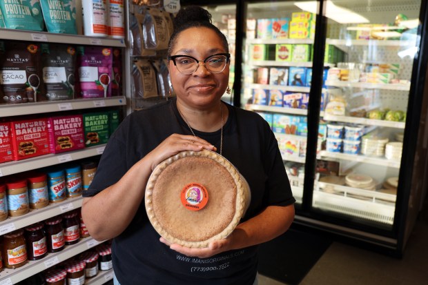 Imani Muhammad sells bean pies at the Go Green Community Fresh Market on W. 63rd Street in Chicago. (Terrence Antonio James/Chicago Tribune)