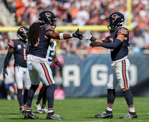 Bears linebacker T.J. Edwards, right, celebrates with linebacker Tremaine Edmunds after stopping the Panthers on third down. (Armando L. Sanchez/Chicago Tribune)