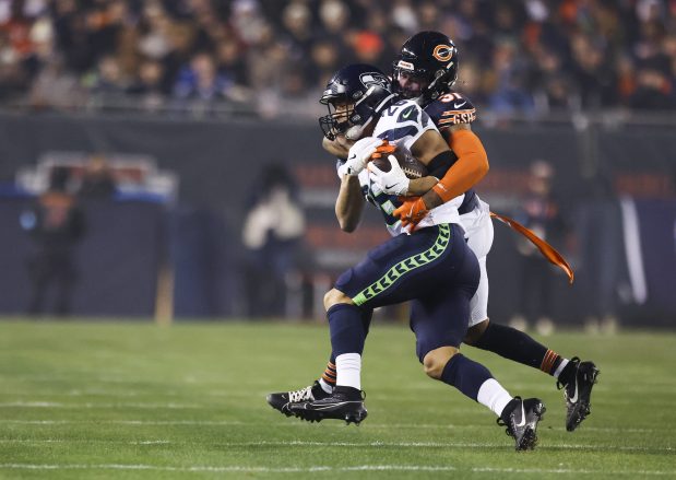 Bears safety Kevin Byard tackles Seahawks running back Zach Charbonnet on Dec. 26, 2024, at Soldier Field. (Eileen T. Meslar/Chicago Tribune)