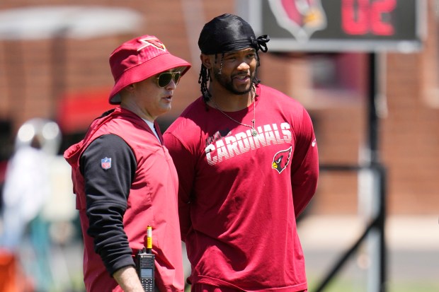 Cardinals quarterback Kyler Murray, right, talks with offensive coordinator Drew Petzing during OTA workouts May 22, 2023, in Tempe, Ariz. (AP Photo/Ross D. Franklin)